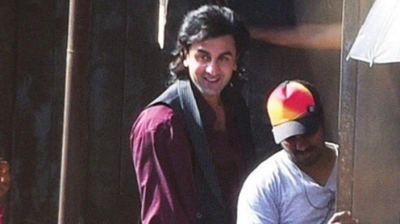 Ranbir Kapoor snapped with long locks while shooting in Mumbai for Rajkumar Hiranis biopic on Sanjay Dutt.y