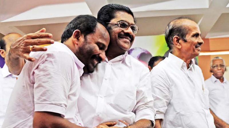 Newly-appointed DCC president hugs KPCC president V.M Sudheeran before taking charge at a ceremony in Thrissur on Thursday. Outgoing DCC president P.A Madhavan is also seen. (Photo: ANUP K VENU)