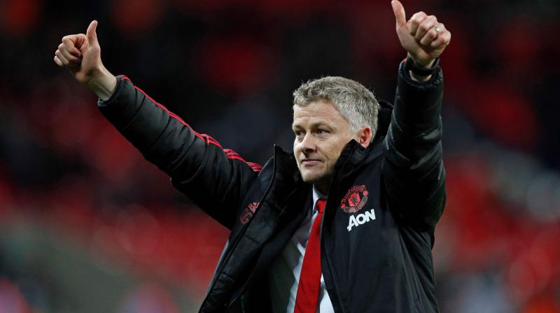 Although Solskjaer admits a league title challenge is unrealistic this season, he backs the squad to catch Tottenham Hotspur, who are seven points ahead in third place. (Photo: AFP)