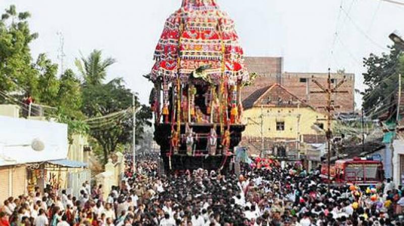 Thousands of devotees witnessed the Masi Brahmotsavam car festival of Arulmigu Subramanyaswamy temple at Tiruchendur near here on Thursday.