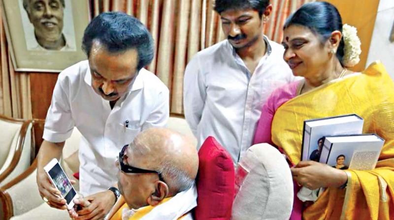 DMK working president M. K. Stalin with his wife and son his father M.Karunanidhi seeking blessings for his 65th birthday, on Thursday.	  DC