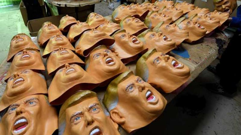 Employees produce rubber masks of Donald Trump at the Ogawa Studios mask factory in Tokyo. (Photo: AFP)