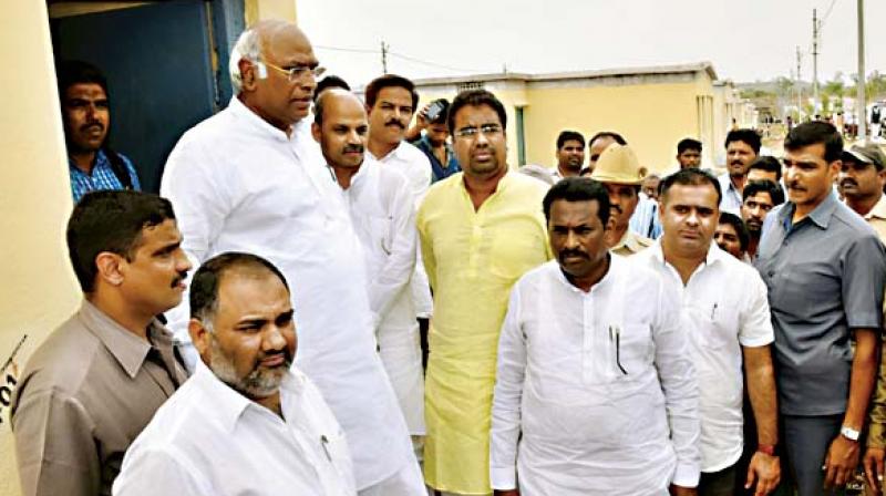 Congress leader in the Lok Sabha M. Malikarjun Kharge at Kesaratagi Green City near Kalaburagi on Thursday to distribute title deeds to beneficaries 	(Photo:  DC)
