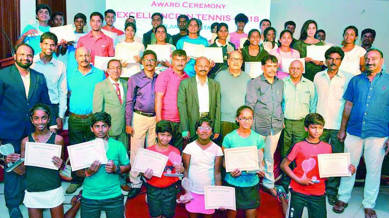 Tennis players from Telangana pose with their trophies and certificates at the awards ceremony in Hyderabad on National Sports Day on Wednesday night.