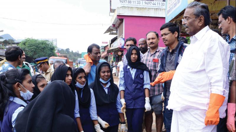 M.I. Shanavas, MP, and Wayanad district collector Keshavendra Kumar interact with student volunteers in connection with the Clean Wayanad mission at Vythiri on Thursday.