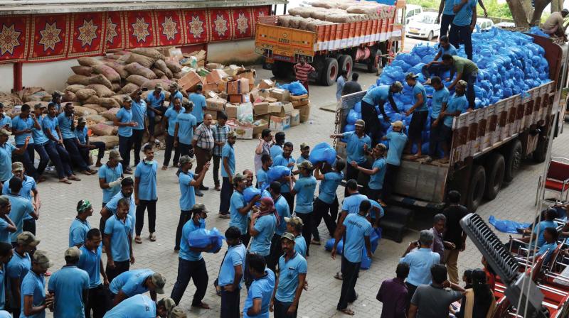 Grocery items for supply in relief camps and households being sorted out by policemen at Ernakulam collectorate (Photo: Arun Chandrabose)