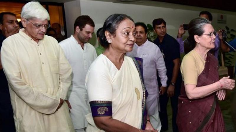 Congress President Sonia Gandhi with presidential candidate Meira Kumar and vice-presidential candidate Gopal Krishna Gandhi after the UPA meeting in New Delhi on Sunday. (Photo: PTI)