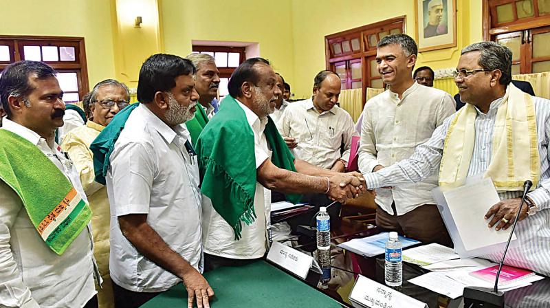 Chief Minister Siddaramaiah interacts with farmers during a pre-budget meeting at Vidhana Soudha on Thursday.