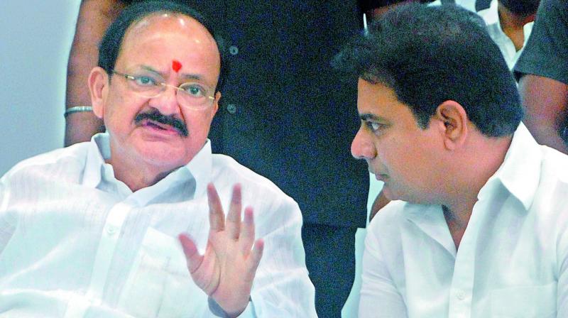 NDAs Vice-Presidential candidate M. Venkaiah Naidu interacts with K.T. Rama Rao at a function on Friday. (Photo: DC)