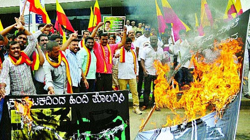 Kannada activists protest against use of Hindi at Majestic Metro station in Bengaluru on Friday. (Photo: DC)