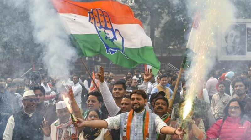 Congress workers celebrate victory in state assembly elections. (Photo: PTI)