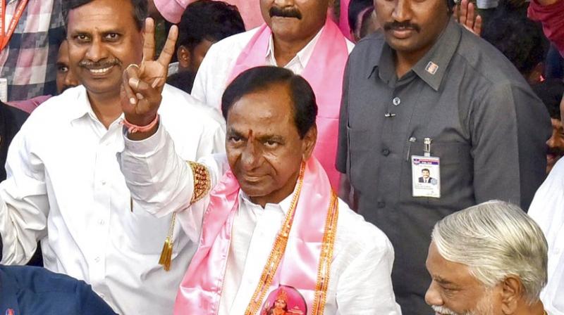Telangana Rashtra Samithi (TRS) chief K Chandrasekhar Rao is greeted by his partyworkers as they celebrate their partys victory in the state Assembly elections, at Telangana Bhavan in Hyderabad. (Photo: PTI)