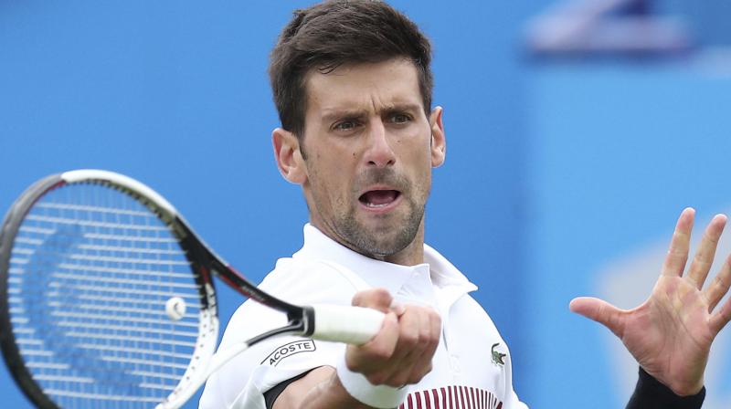 Novak Djokoviccompeting during the week before Wimbledon for the first time in seven years, saved a pair of set points in the second set before finally putting Young away after a lengthy tie-break.(Photo: AP)