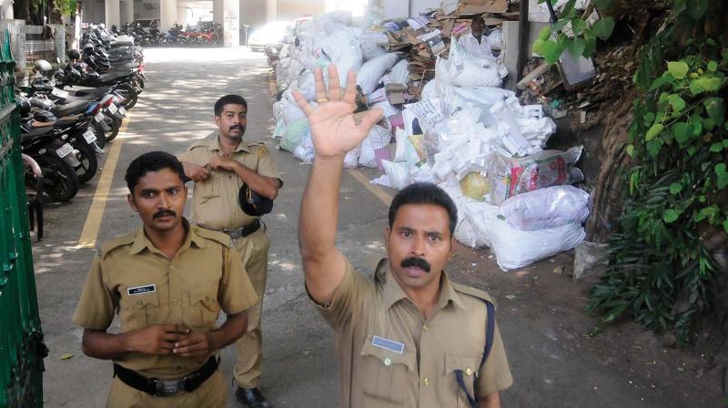 A security officer warns against taking pictures of the garbage dump near the (West) gate of the secretariat on Tuesday. The incinerator unit at the seat of administration is dysfunctional for long. (Photo: A.V. MUZAFAR)