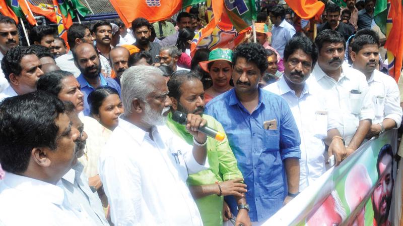 BJP State president Kummanam Rajasekharan speaks at a protest organised by BJP councillors alleging Thiruvananthapuram Corporations inefficiency in bringing dengue under control. BJP district president S. Suresh, Melamcode councillor R. Sanilkumar, Nemom councillor M.R. Gopan, and Karamana councillor Ajith are also seen. (Photo: A.V. MUZAFAR)