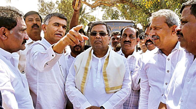 Chief Minister Siddaramaiah and Agriculture Minister Krishna Byregowda during inspection of works on alternative roads to Kempegowda International Airport in Bengaluru. (Photo: DC)