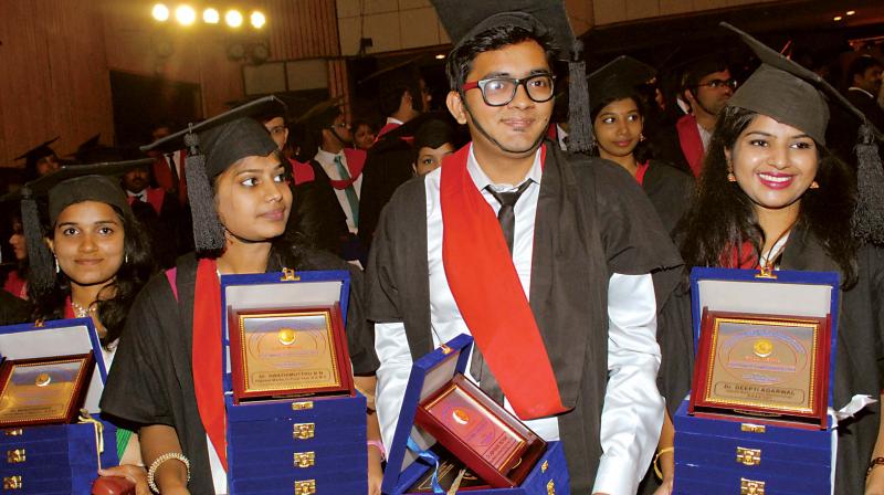 Students with their gold medals during the 19th annual convocation of Rajiv Gandhi University of Health Sciences in Bengaluru on Thursday. (Photo: DC)