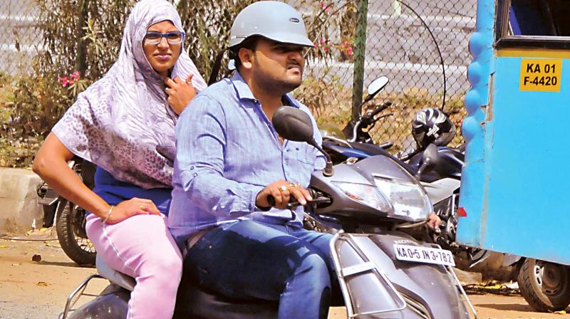 24 per cent  of the respondents believed that pillion riders were less at risk of head injury  and  23 per cent of riders admitted to allowing their  pillion rider to go without a helmet. (Photo: DC)