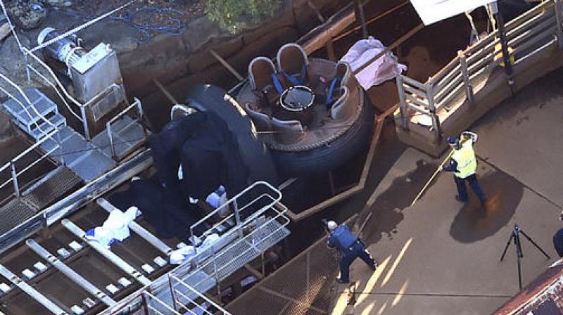 Rescue personnel stand by the Thunder River Rapids ride at Dreamworld on the Gold Coast, Australia. (Photo: AP)