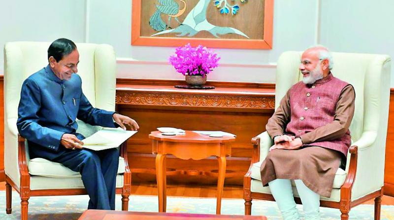 Prime Minister Narendra Modi and Telangana state Chief Minister  K. Chandrasekhar Rao smile at each other as they hold discussion in New Delhi on Wednesday.