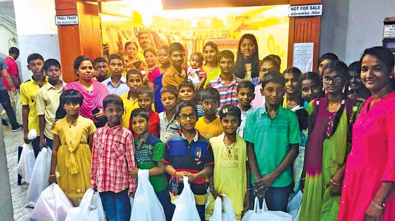 Families all smiles after buying clothes for Deepavali.