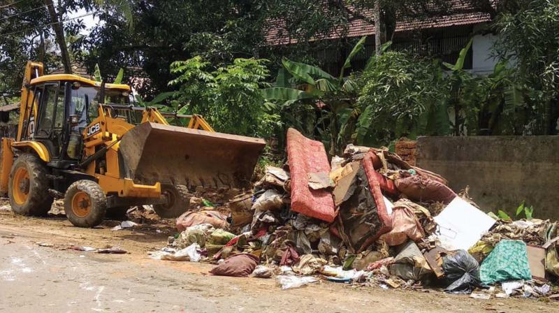 Flood waste being removed from Chendamangalam panchayat area .