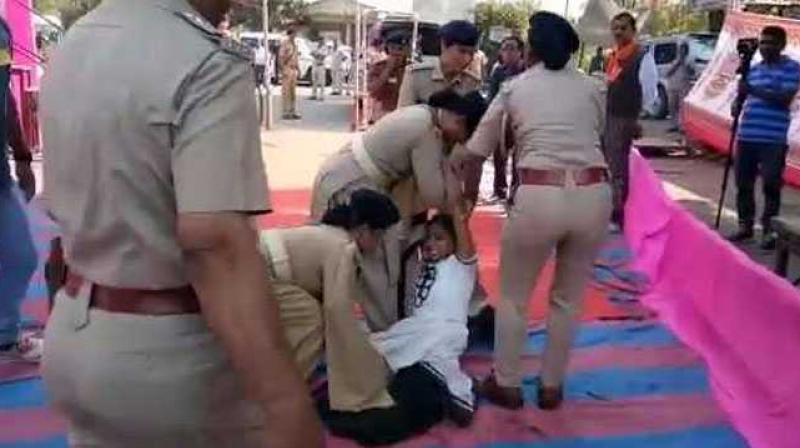 The woman police officials dragged Rupal Tadvi, 26, when she rushed towards Gujarat Chief Minister Vijay Rupani during a rally in Kevadia Colony in Vadodara. (Photo: Videograb)