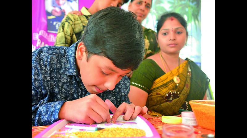 Fourteen-year-old Emmadisetty Kowshik, a student of Class 9, has taken up micro-carving of the National Anthem on tur dal in order to make a world record.