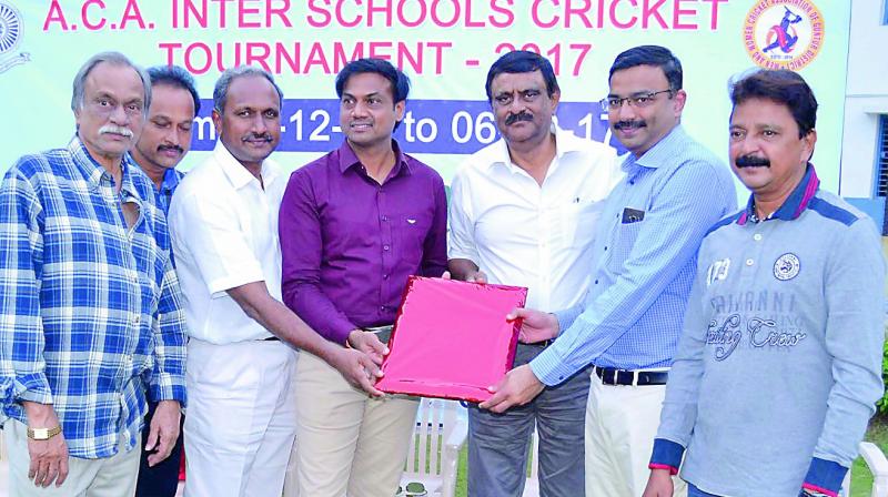 Indian cricket team chief selector M.S.K. Prasad congratulates renowned knee replacement surgeon  Dr B. Narendra Reddy on being awarded world record, in Guntur city on Wednesday. (Photo: DC)
