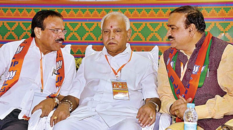 State BJP president B.S. Yeddyurappa flanked by leaders H.N. Ananthkumar and D.V. Sadananda Gowda at the partys executive committee meet in Kalaburagi on Saturday