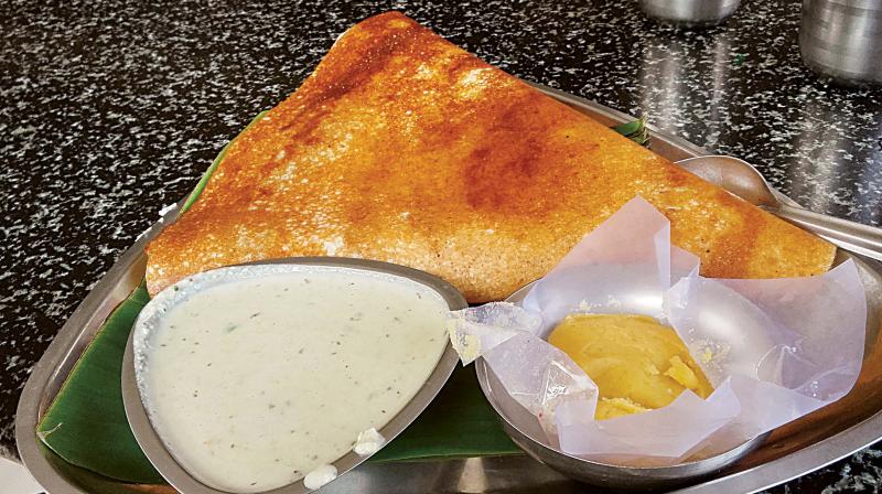 Mysuru masala dosa has a layer of red chutney with flavours of various spices lined inside, which makes it unique 	(Photo  DC)