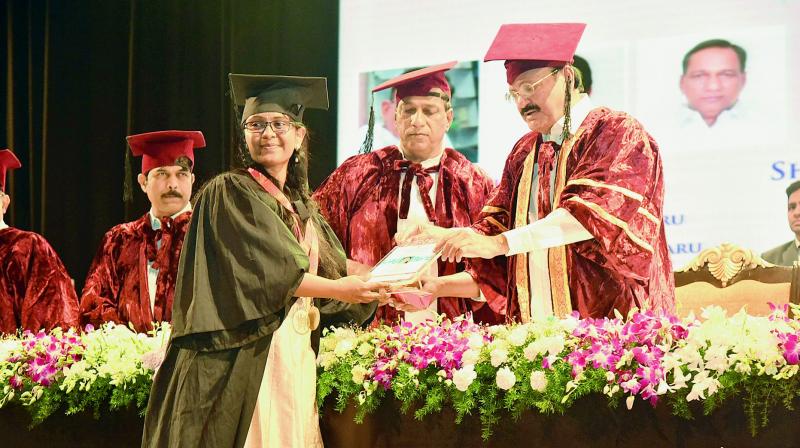 Vice-president Venkaiah Naidu presents medals to toppers during the graduation ceremony at Malla Reddy Institute of Medical and Dental Sciences on Saturday.   (Image: DC)