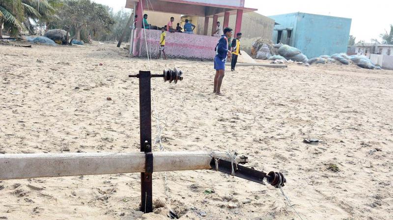 An electric pole was damaged due to Vardah cyclone in city. (Photo: DC)