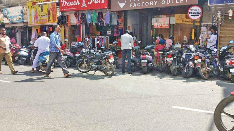 The sudden change in two-wheeler parking in Puducherry has caused inconvenience to people, who end up parking the vehicle in Haphazard way, as seen above. (Photo: DC)