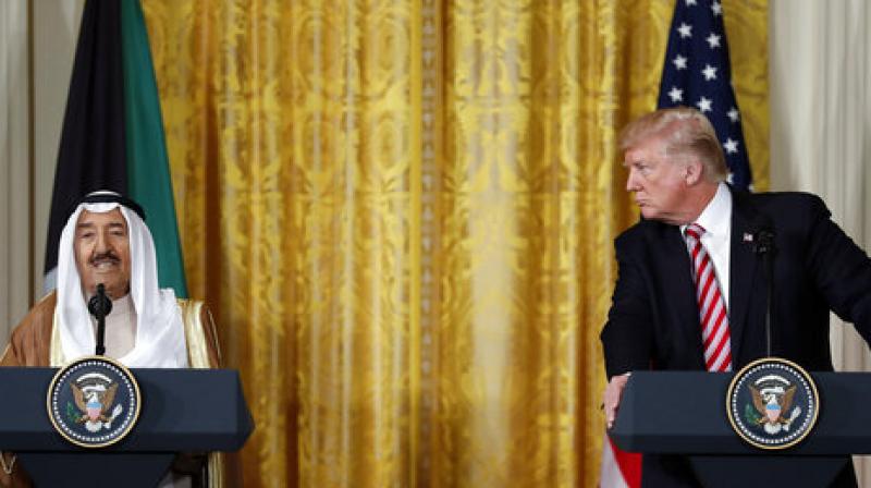 President Donald Trump looks to Emir of Kuwait Sheikh Sabah Al Ahmad Al Sabah as he speaks during a news conference in the East Room of the White House in Washington (Photo: AP)