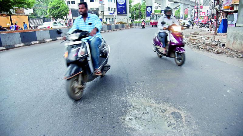 Motorists avoid a pothole on Lal Bungalow road. 	(Image: DC)