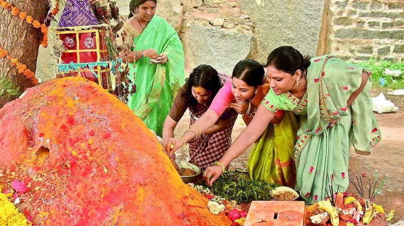 Women perform puja during Bonalu celebrations at Golkonda fort on Sunday.  (Image: DC)