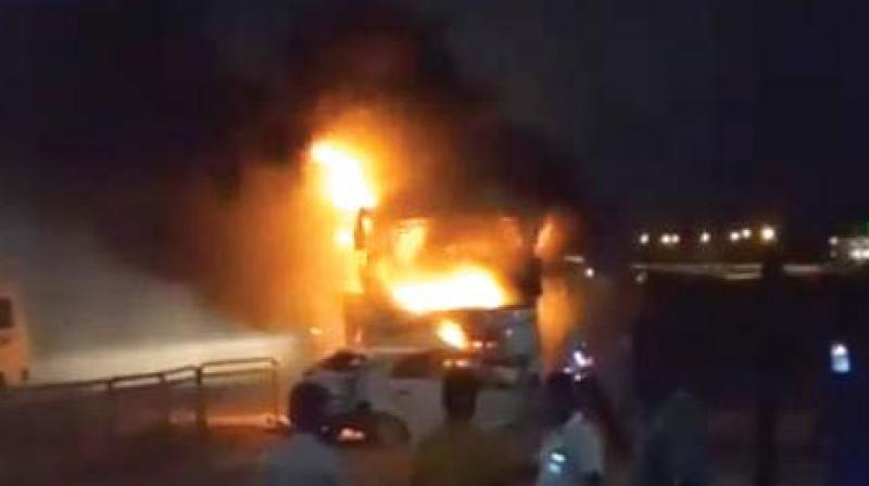 A private bus burns as car crashed into it in Bengaluru on Sunday