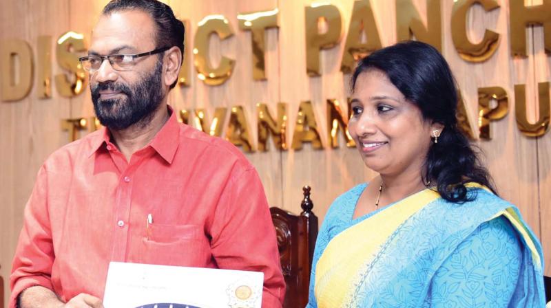 District panchayat vice-president A. Shailaja Beagum releasing the District Panchayat budget by handing over a copy to president V.K. Madhu. (Photo: DC)