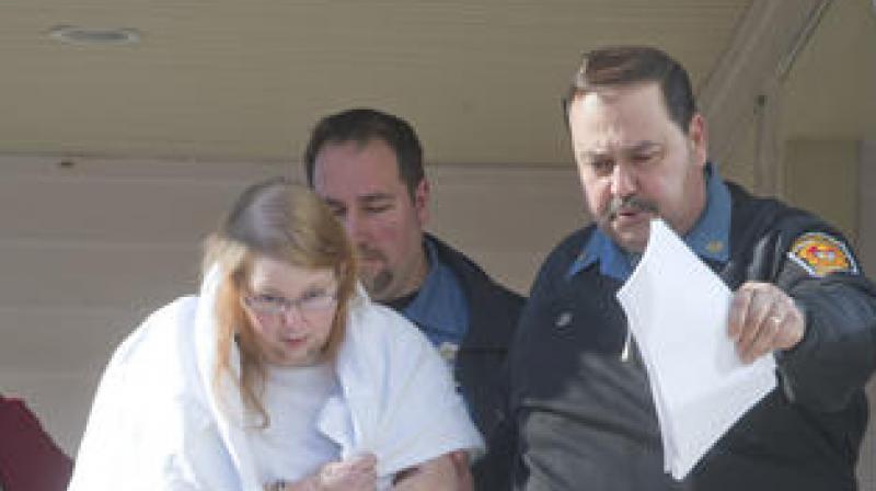 Constables escort Sara Packer out of the courtroom of District Judge Michael Petrucci in Newtown, Bucks County on Sunday. (Photo: AP)