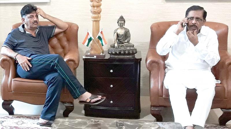 Energy Minister D.K. Shivakumar with KPCC chief Dr G. Parameshwar at his residence in Bengaluru on Sunday. (Photo: DC)