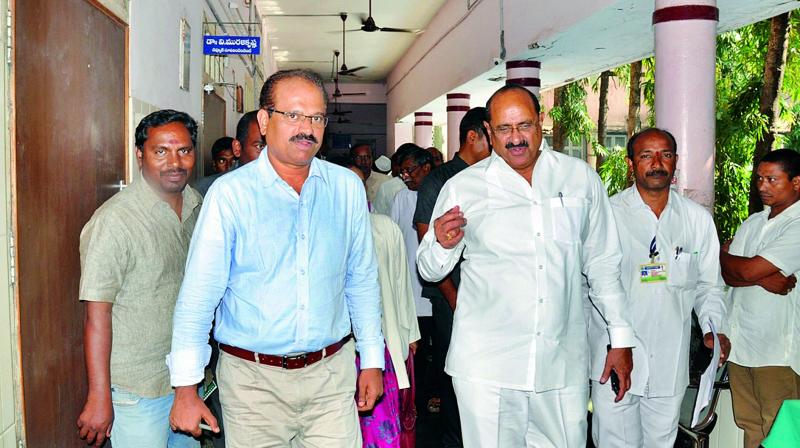 Health minister K. Srinivas, with Collector H. Arunkumar during his visit to the GGH in Kakinada on Saturday. (Photo: DC)