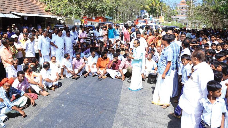 Public block Sulthan Bathery-Ooty inter-state highway at Koliyadi near Sulthan Bathery in protest against the recurring wildlife attacks, on Tuesday.