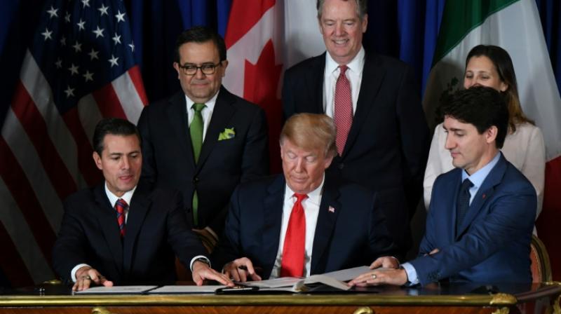 The USMCA - the new NAFTA trade agreement - was signed in Buenos Aires on November 30, 2018 by (L to R) Mexican President Enrique Pena Nieto, US President Donald Trump and Canadian Prime Minister Justin Trudeau. (Photo: AFP)