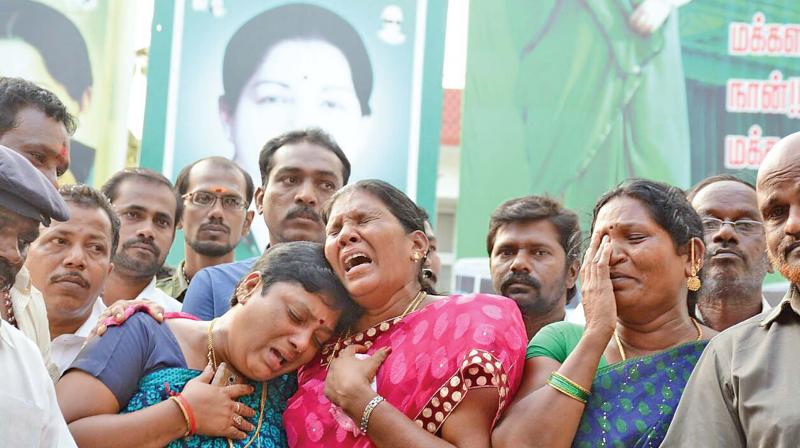 Chief Ministers supporters cry outside Apollo Hospital on Monday.