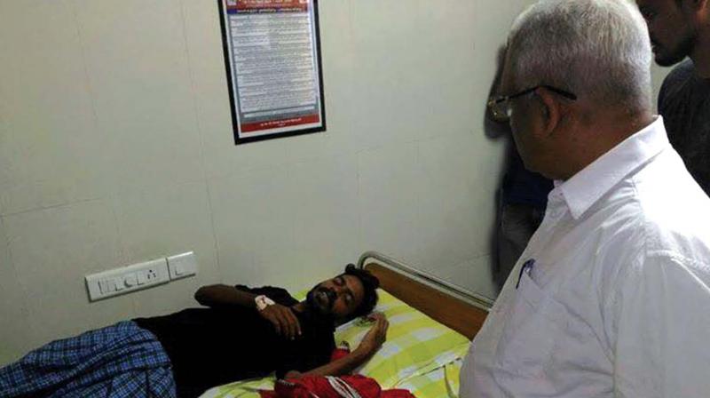 CPM Kannur district secretary P. Jayarajan visits Jefrin Jerald at AKG hospital.