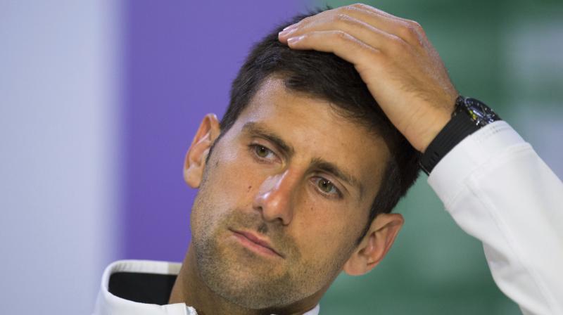Former world number one Novak Djokovic, struggling back from a long injury lay-off, confirmed on Wednesday that he had split with his coaches Andre Agassi and Radek Stepanek. (Phgoto: AP)