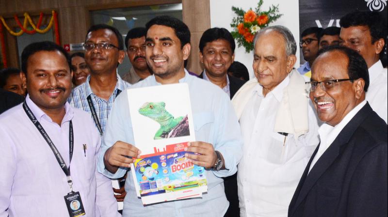 IT minister Nara Lokesh releases a poster in the presence of TD senior leader and MLC M.V.V.S. Murthi at the inauguration of software companies, Tech Hub - APEITA inside AP Cyber Towers in Visakhapatnam on Tuesday.