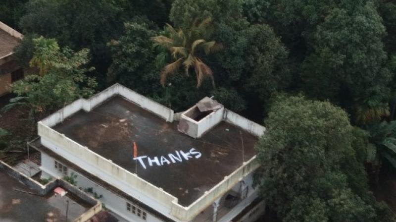 To express their gratitude to the rescue team, people thanked Naval rescue chopper pilot Commodore Vijay Varma and his men by painting a huge Thanks on the roof of a house. (Photo: Twitter | ANI)