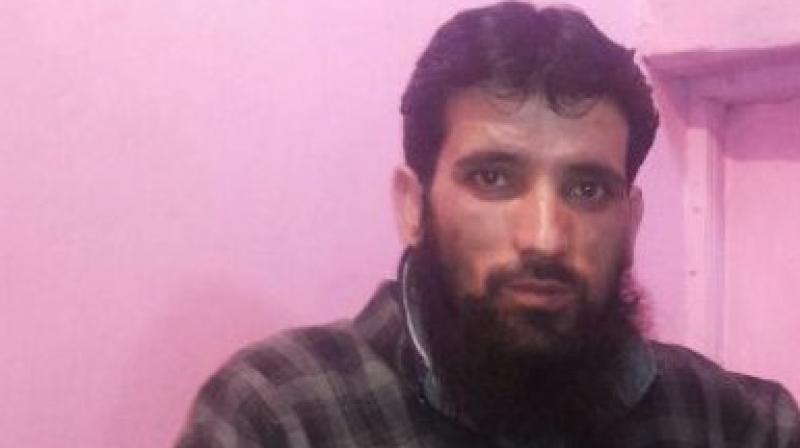 The Jammu & Kashmir Police on Friday detained Hizbul Mujahideen terrorist Gulzar Dar in Pulwama districts Tral. (Photo: ANI)